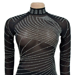 Close-up of black mesh top featuring elegant wave-patterned silver rhinestones and high neck