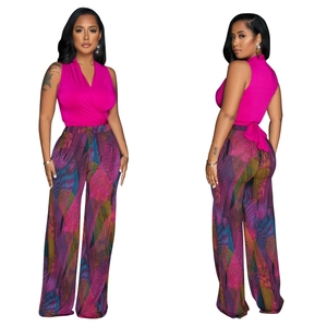 Detail view of pink sleeveless top and geometric print wide leg trousers set for women