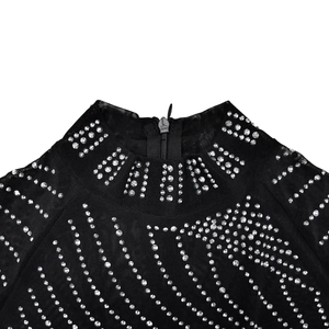 Detail of sheer black mesh neckline with silver rhinestones and a metal zipper back closure