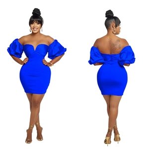 Detail of royal blue bodycon mini dress featuring puff sleeves and open back design