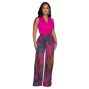 Close-up of magenta V-neck sleeveless top paired with abstract print wide-leg trousers