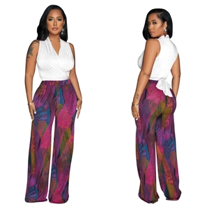 Detailed front and back view of a white V-neck wrap top and colorful wide-leg floral pants