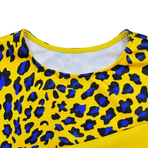 Close-up detail of the yellow leopard print knit dress neckline with blue and black patterns