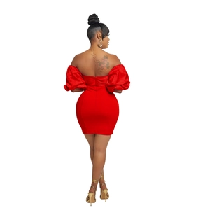 Detailed back view of the red satin mini dress featuring dramatic puff sleeves and slim fit