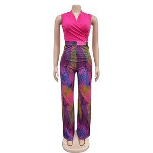 Close-up of pink V-neck sleeveless top with colorful geometric pattern wide-leg pants