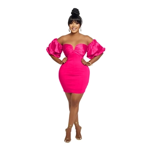 Detail of hot pink off-shoulder mini dress with puff sleeves and ruched texture