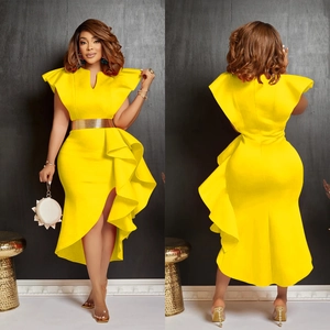 Detail of yellow ruffled dress with an asymmetrical hem and a bold gold metallic belt