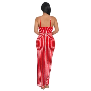 Detail of red floor-length dress featuring vertical white sequin stripes and open back design