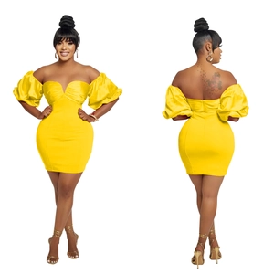 Detailed view of yellow off-shoulder mini dress with puff sleeves and ruched back design