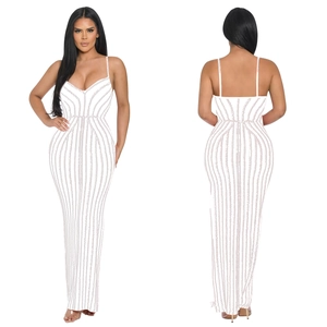 Detail of white slim-fit maxi dress showing fine rhinestone textures and thin straps