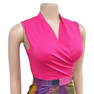 Close-up of pink V-neck sleeveless top and geometric print skirt on mannequin