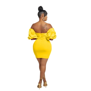 Detailed back view of bright yellow off-shoulder mini dress with puff sleeves and zipper