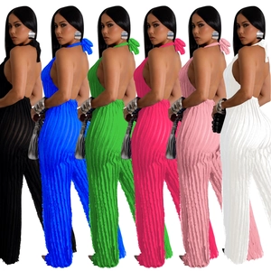 Women's pleated backless halter jumpsuit in multiple vibrant colors and wide leg style
