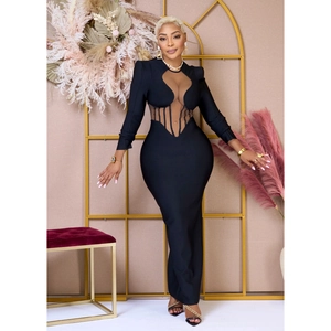 Detail of sheer mesh paneling and boning on a black bodycon long sleeve maxi dress