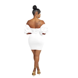 Detail of white off-shoulder dress featuring puffy sleeves and hidden back zipper