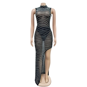 Close-up of black mesh dress featuring intricate rhinestone wave patterns and high-neck detail