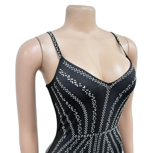 Detail of black strapless dress featuring intricate silver geometric rhinestone patterns