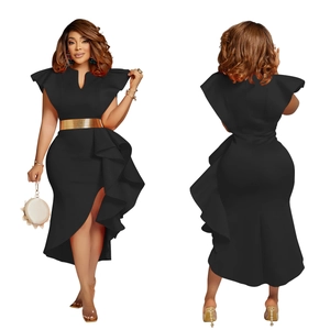 Detail view of black ruffle dress with golden waist belt and irregular fishtail hem