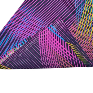 Detail of colorful geometric striped fabric showing high-quality double-needle hem stitching