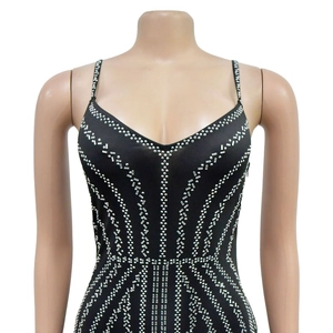 Detailed view of silver rhinestones in geometric patterns on black bodycon evening dress