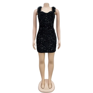 Detail of black sequined mini dress with fluffy feather shoulder straps and bodycon fit