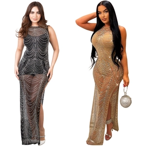 Detail of mesh evening dresses with rhinestone patterns in black and champagne gold colors