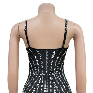 Close-up of the back detail on a black slim-fit dress featuring radiant silver rhinestones