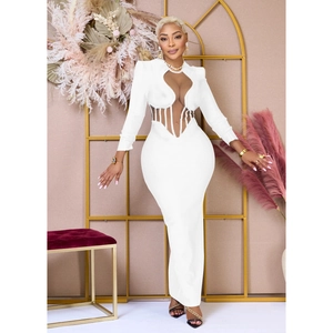 Detail of white slim-fit dress featuring sheer mesh patchwork and hollow-out cutouts