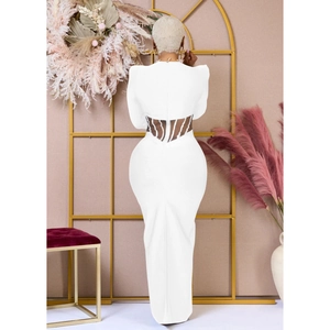 Detailed back view of white backless dress featuring cutout strappy waist detailing