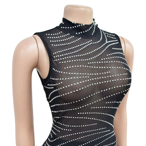 Detail of black mesh sleeveless bodysuit with silver rhinestones in wavy patterns