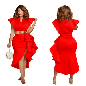 Detailed view of red asymmetrical dress featuring ruffle sleeves and a metallic gold belt