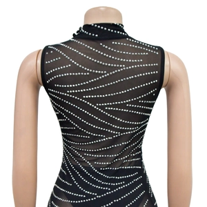 Detail of sheer black mesh bodysuit featuring rhinestone geometric stripes on the back