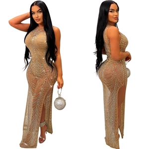 Close-up of mesh evening dress with silver rhinestones and sexy side high slit detail