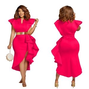 Detail of hot pink V-neck dress featuring ruffled sleeves and a metallic gold waist belt