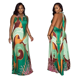 Elegant halter neck green maxi dress with abstract print and open back design