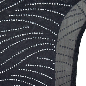 Detail of sheer black mesh dress with elegant silver rhinestones and high-quality stitching
