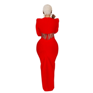 Detail of red maxi dress featuring sheer black and red striped mesh cutout on back
