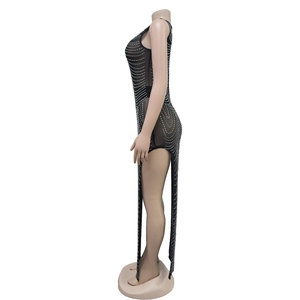 Detail of black sheer mesh sleeveless dress with sparkling silver rhinestones and high side slits
