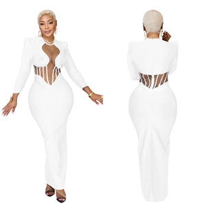 Detail of white long sleeve dress showing mesh patchwork and front cutout structure