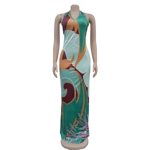 Detail of emerald and ginger abstract print on halter neck maxi dress fabric