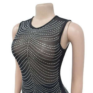 Detail of mesh bodysuit with silver rhinestones in wavy patterns on mannequin