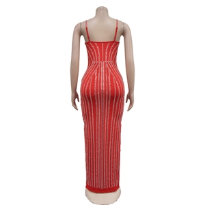 Detail of red slim fit evening gown featuring silver sequin stripes and open back design