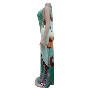 Detail view of backless halter maxi dress with abstract geometric floral print in teal