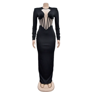 Detail of sheer mesh patchwork and vertical stripes on a black bodycon evening dress