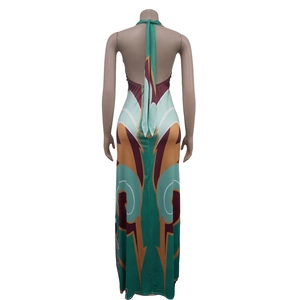 Back view of a halter neck backless maxi dress featuring colorful geometric print