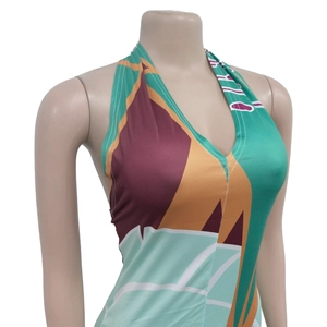 Detail view of the deep V-neck halter design and geometric pattern on the summer dress
