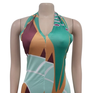 Detail of deep V-neck halter dress with vibrant geometric and floral print patterns