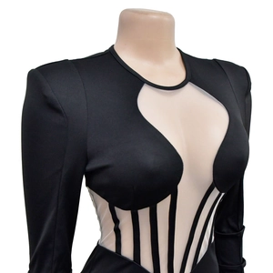 Detail of sheer mesh panels and corset-style boning on black long sleeve bodysuit