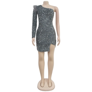 Close-up of grey sequin mini dress with feather shoulder detail and asymmetric sleeve