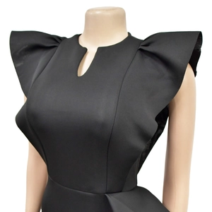 Detail of elegant black dress showing ruffle sleeves and keyhole neckline cutout